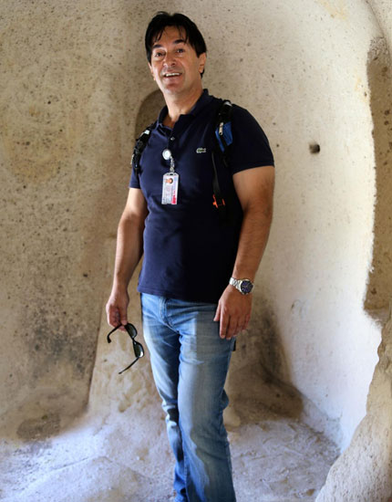 Zeki-wearing-his-badge-in-a-Cappadocian-cave